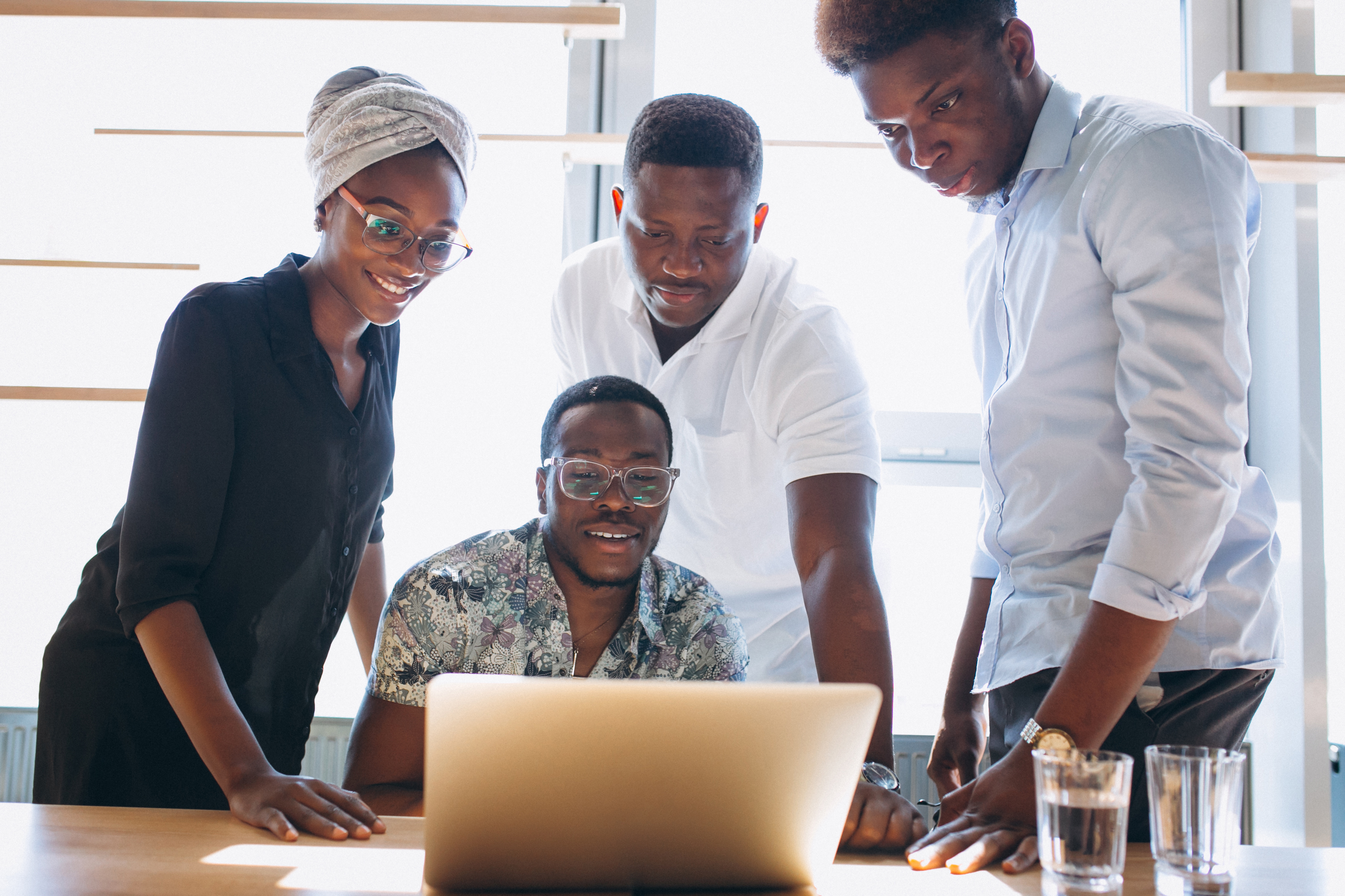 Diverse team engaged in a corporate communication presentation in a modern office